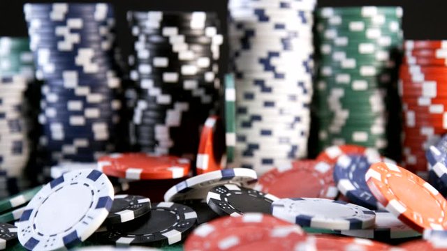 Casino Chips Fall On Table in Slow Motion