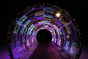 Decorative lighting tunnel at night in winter
