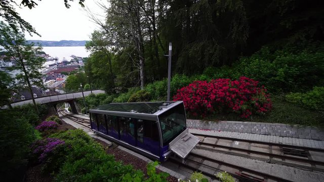 Floyen mountain Floibanen funicular railcar train. Popular landscape for hikes & summer tours. Bergen, Norway city harbor views. Norway in summer, 4k. 