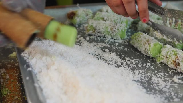 Man Cooking Putu Bamboo Dessert. Rice Flour And Grated Coconut. Traditional Malaysian Food. 4K Footage.