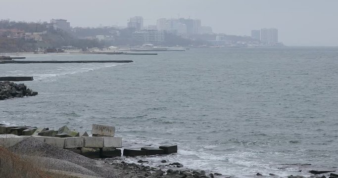Coast of Black sea in Odessa at winter day, waves