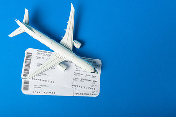 Aircraft top view, Airline boarding pass tickets on the desk. The journey begins. Travel concept with empty space for text