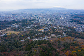 High aerial view of Nara city, Todaiji temple stands at base of Mt Wakakusa