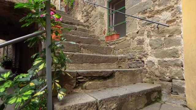 Walking up stone steps in the Cinque Terre village of Corniglia in the province of La Spezia
