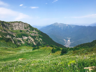 Fototapeta na wymiar Beautiful view from the peak of Caucasus mountains. Roza Khutor, Russia