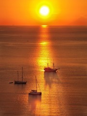 Naklejka na ściany i meble sailing boats during sunset 