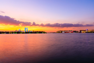 Naklejka premium Beautiful suzhou city skyline and architecture with lake at sunset,China.