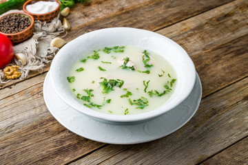 soup chikhirtma on bowl on wooden table