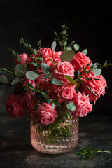 Bouquet of pink roses in a vase.
