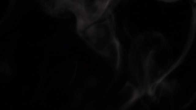 Motion of white steam smoke overlay effect on solid black background with abstract blur swirl wave motion for pollution, wildfire, vapor cigarette, gas, dry ice, warm hot food, boilling noodle soup