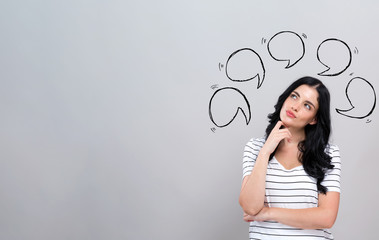 Speech bubbles with young woman in a thoughtful face