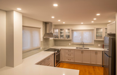New and Modern Open Concept Kitchen with a Grey and White Color Scheme