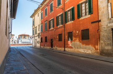 Fototapeta na wymiar Narrow streets of Pisa ancient town with traditional architecture, Italy