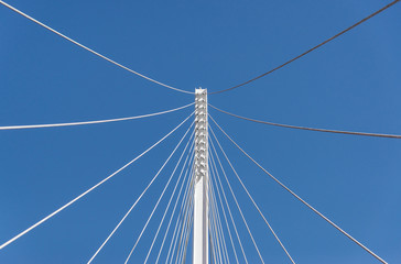 Abstract geometric architectural elements of a bridge against blue sky