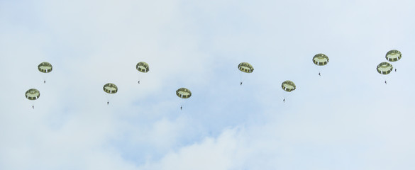 Parachute soldiers in the sky