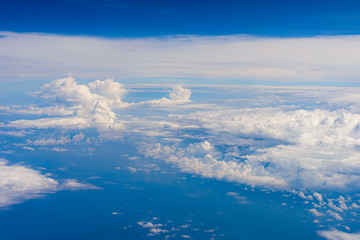 Fototapeta na wymiar View of clouds and sky from airplane window