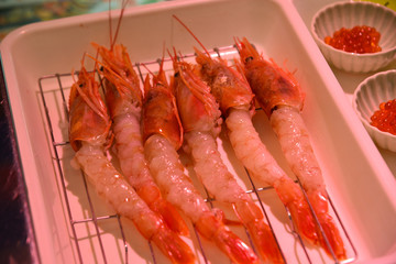 Raw fish sashimi at traditional market