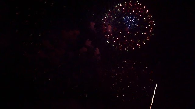 Beautiful abstract colourful Fireworks explode display on sky at night a symbol of celebration in New years anniversary for background