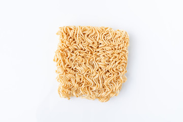 Yellow instant noodle of uncook food on white background with copyspace.  