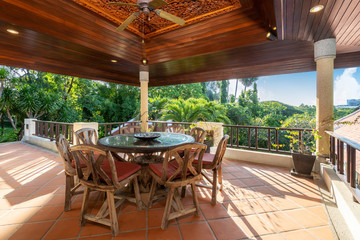 Outdoor dining wood table in the house