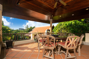 Fototapeta premium Outdoor dining wood table in the house