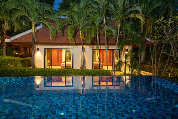Thai Balinese  luxury home with infinity swimming pool , night time