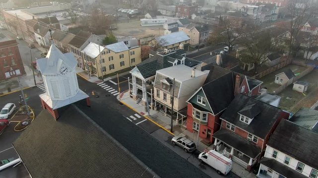 Aerial drone slow flyover reveals a colorful row of homes in small town, Manheim, Pennsylvania, USA