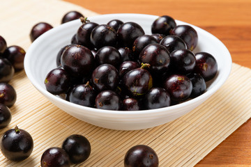 Jabuticaba in the bowl. Jaboticaba or Jabuticaba is the native Brazilian grape tree. Species Plinia Cauliflora. Brazilian Berry.