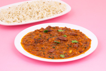 Rajma Chawal or Rajma Jeera Chawal (Rice) is a Traditional North Indian Food, Consisting of Cooked Red Kidney Beans in a Thick Gravy with Spices. Served with Jeera Rice