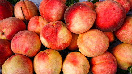 Sweet red ripe peaches at the rural market