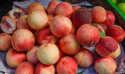 Sweet red ripe peaches at the rural market