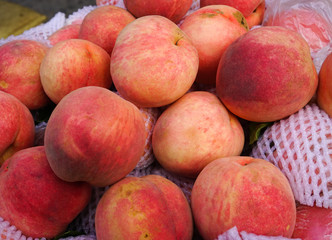 Sweet red ripe peaches at the rural market