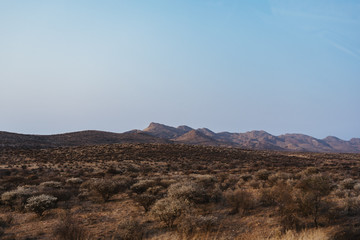 panorama photo of landscape with mountains in background in Namibia