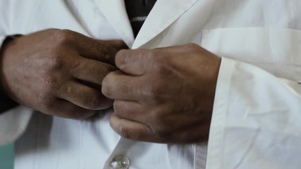Primary School Teacher in Argentina putting on the White School Uniform. Close-Up. 
