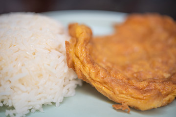 Omelet with cooked rice in Thai style.