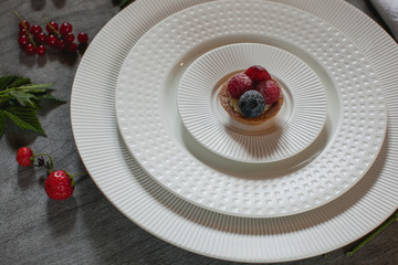 plate with pancakes with blueberries and raspberries