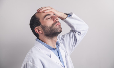 Caucasian depressed doctor in clinic.