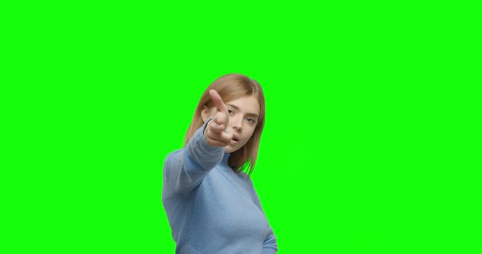 Girl shooting gesture on green screen