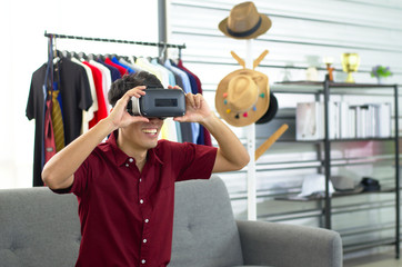 A vlogger testing a portable virtual reality VR motion simulator
