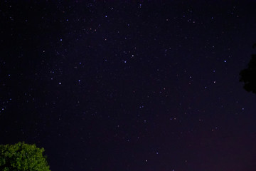 Time lapse of galaxies and meteor at night