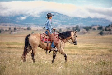 Cowgirl on Buckskin
