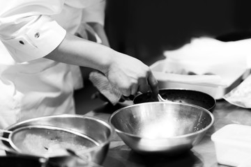 Chef cooking in a kitchen, chef at work, Black & White.