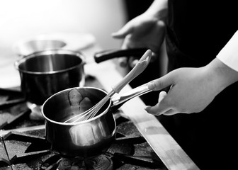 Chef cooking in a kitchen, chef at work, Black & White.