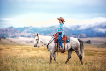 Cowgirl On Grey Horse