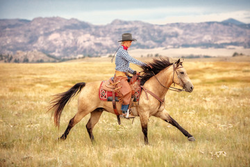 Cowgirl on Buckskin