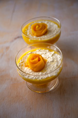 Sweet tapioca pudding with coconut milk and fresh mango flowers