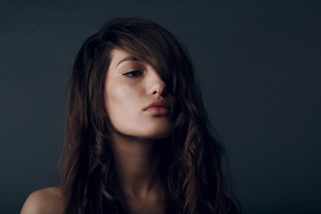Fototapeta premium Portrait of beautiful young brunette woman with healthy hair