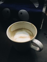 cup of coffee on black background