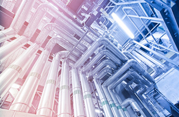 Equipment, cables and piping as found inside of a modern industrial power plant