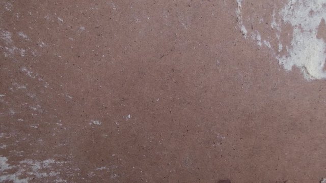 Heart drawn in sawdust on carpenter's desk. Strong wind blows heart away. Concept of   separation, divorce, completion of the relationship, unrequited love.